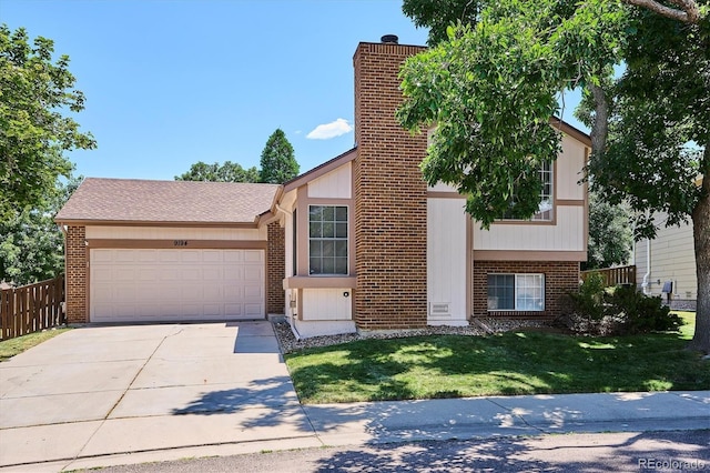9194 Hickory Cir, Highlands Ranch, CO 80126 - view of front of property with a garage, concrete driveway, and brick siding