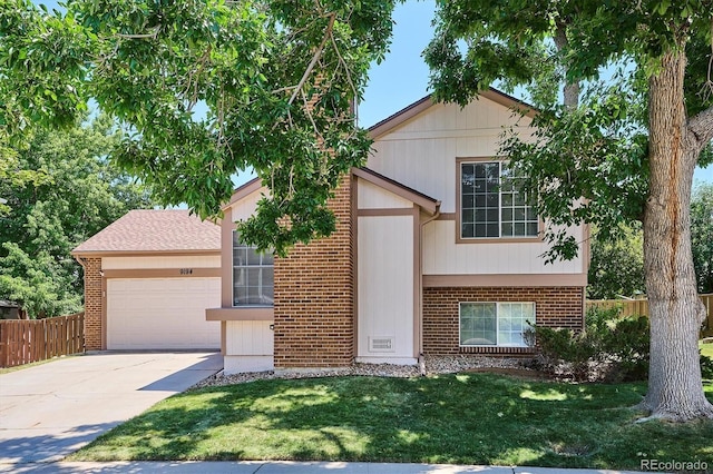 9194 Hickory Cir, Highlands Ranch, CO 80126 - view of front of home with a garage, concrete driveway, and brick siding