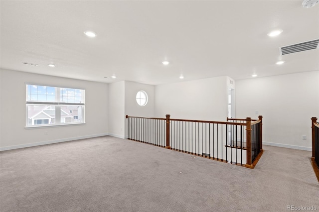 unfurnished room with recessed lighting, visible vents, and a healthy amount of sunlight