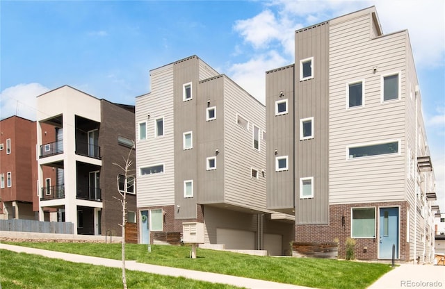 1238 Quitman St Unit 2, Denver, CO 80204 - view of building exterior featuring a garage