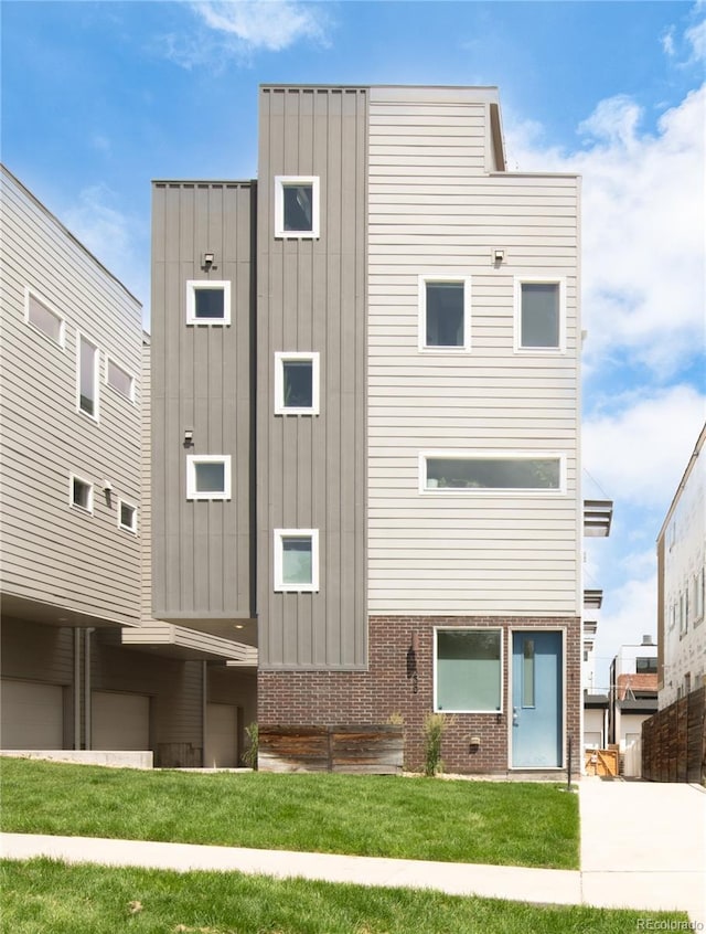 1238 Quitman St Unit 2, Denver, CO 80204 - view of front of house featuring board and batten siding and brick siding