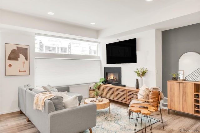 1238 Quitman St Unit 2, Denver, CO 80204 - living area with wood finished floors, a glass covered fireplace, and recessed lighting