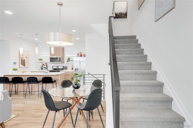 1238 Quitman St Unit 2, Denver, CO 80204 - stairs with wood finished floors and recessed lighting