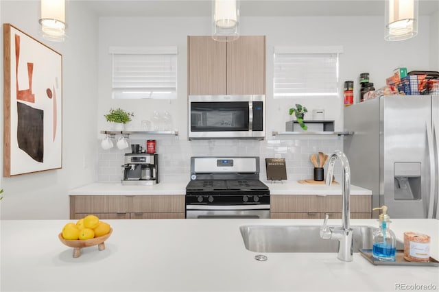 1238 Quitman St Unit 2, Denver, CO 80204 - kitchen featuring stainless steel appliances, modern cabinets, and decorative backsplash