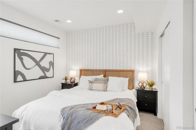 1238 Quitman St Unit 2, Denver, CO 80204 - bedroom featuring an accent wall, wallpapered walls, light colored carpet, and recessed lighting