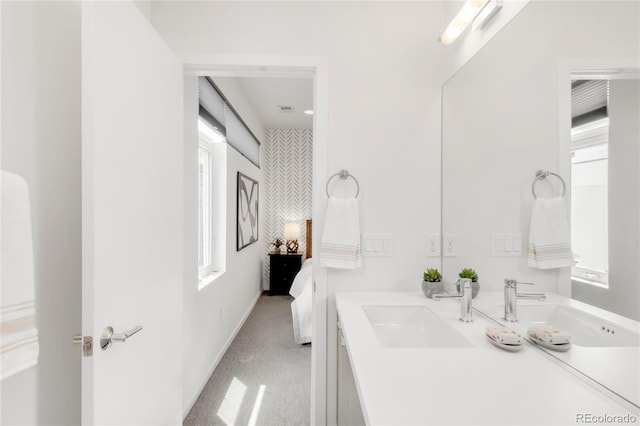 1238 Quitman St Unit 2, Denver, CO 80204 - ensuite bathroom featuring vanity and baseboards