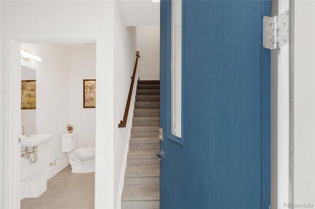 1238 Quitman St Unit 2, Denver, CO 80204 - stairway featuring tile patterned floors and baseboards