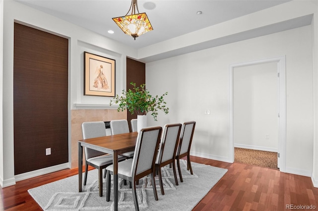 dining room with dark hardwood / wood-style floors