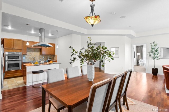 dining room featuring light wood-type flooring