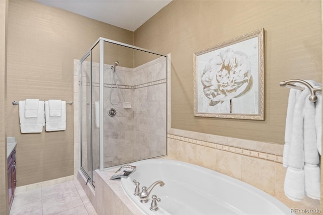 bathroom featuring tile patterned flooring, vanity, and shower with separate bathtub