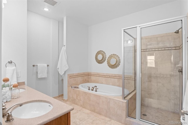 bathroom featuring tile patterned flooring, vanity, and shower with separate bathtub