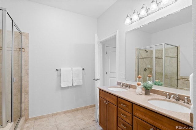 bathroom with tile patterned floors, vanity, and an enclosed shower