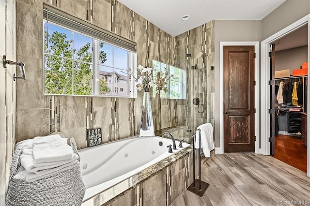 7367 S Tempe Ct, Aurora, CO 80016 - bathroom with a stall shower, a tub with jets, and a spacious closet