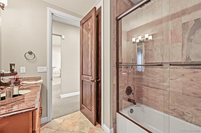 7367 S Tempe Ct, Aurora, CO 80016 - bathroom featuring vanity, marble look tile flooring, and bathtub / shower combination