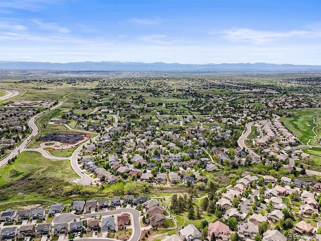7367 S Tempe Ct, Aurora, CO 80016 - aerial overview of property's location with a mountainous background and nearby suburban area