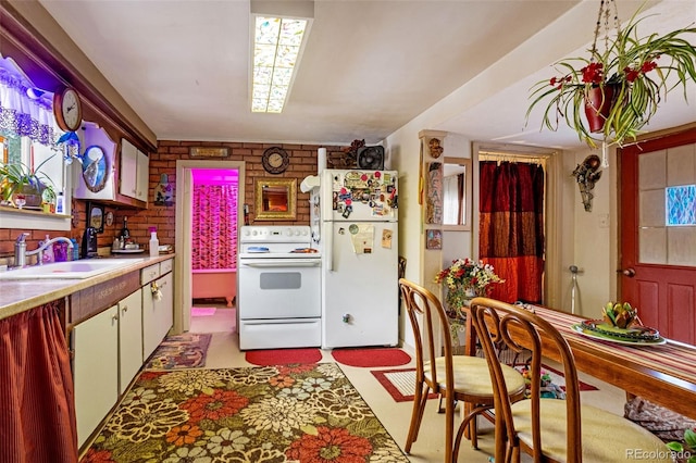 kitchen featuring sink and white appliances