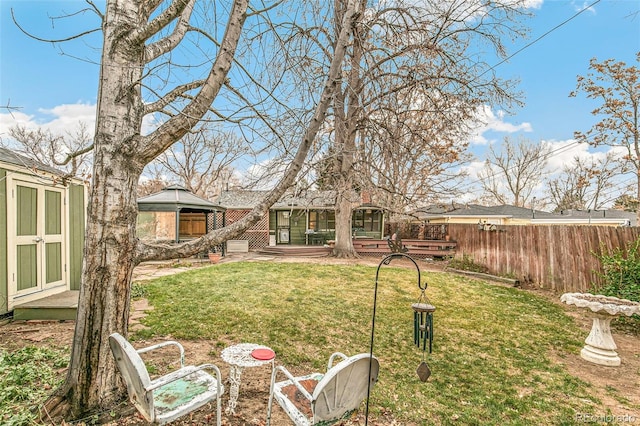 view of yard with a storage unit and a wooden deck