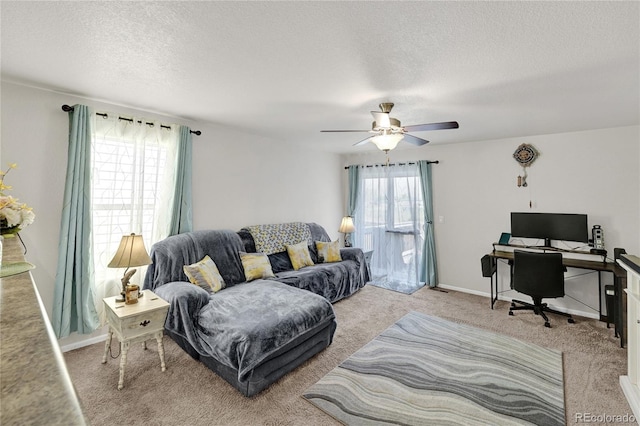 47349 Lily Ave, Bennett, CO 80102 - carpeted living area with a textured ceiling, an office area, a ceiling fan, and baseboards