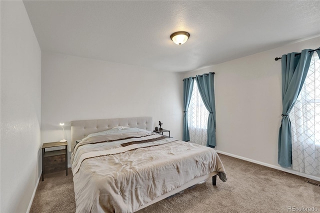 47349 Lily Ave, Bennett, CO 80102 - bedroom with carpet, baseboards, and a textured ceiling