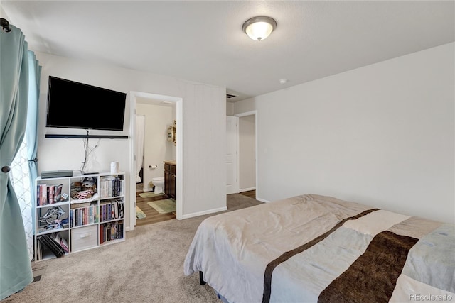 47349 Lily Ave, Bennett, CO 80102 - carpeted bedroom featuring connected bathroom and baseboards