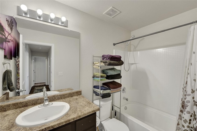 47349 Lily Ave, Bennett, CO 80102 - full bathroom with vanity, shower / tub combo, and toilet