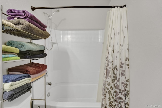 47349 Lily Ave, Bennett, CO 80102 - bathroom featuring shower / bath combo and toilet