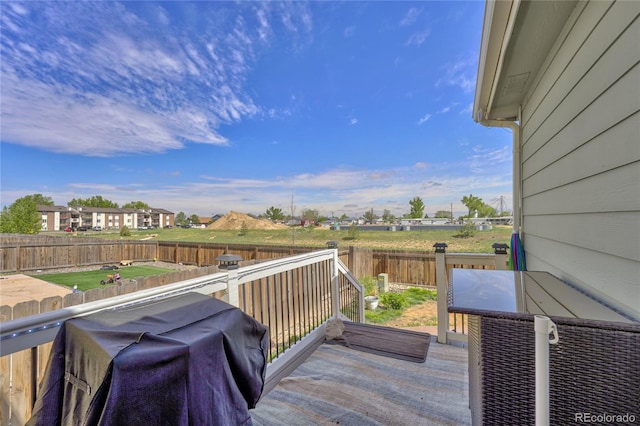 47349 Lily Ave, Bennett, CO 80102 - wooden deck with a fenced backyard