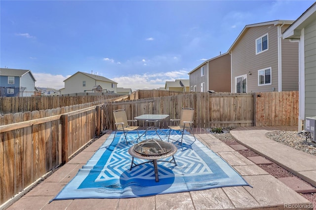 47349 Lily Ave, Bennett, CO 80102 - view of patio featuring an outdoor fire pit and a residential view