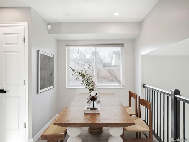 dining room with recessed lighting and baseboards