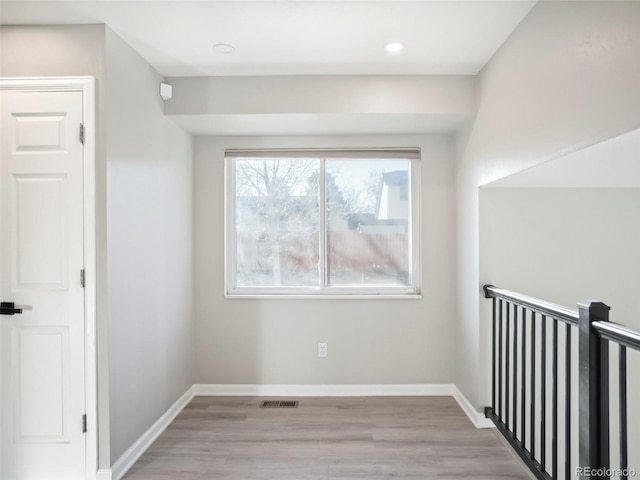 additional living space featuring recessed lighting, baseboards, visible vents, and light wood-type flooring