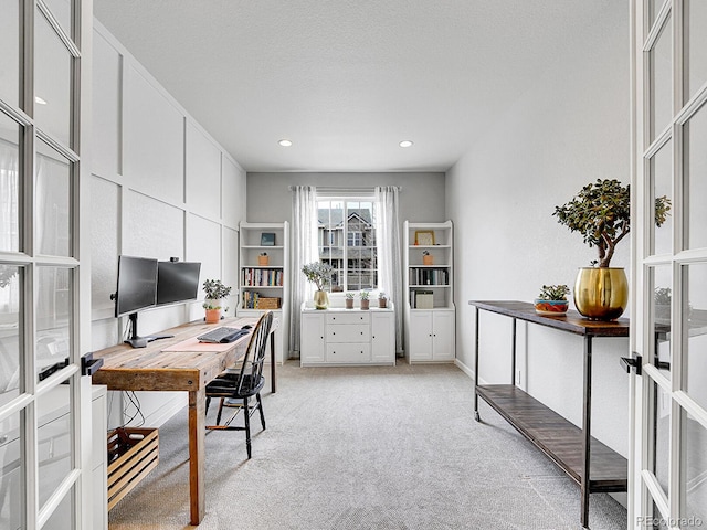 office featuring recessed lighting, light colored carpet, french doors, and a textured ceiling