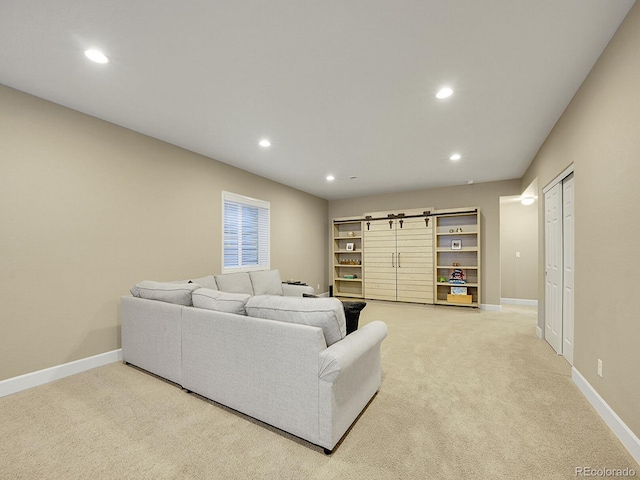 living area with recessed lighting, baseboards, and light carpet