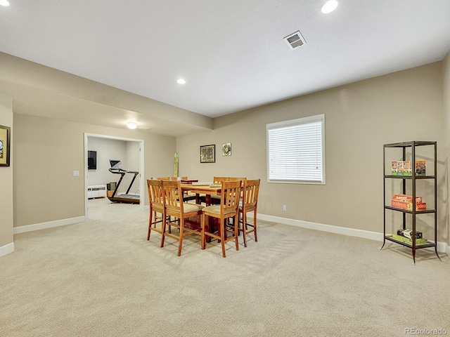 dining space featuring recessed lighting, light colored carpet, visible vents, and baseboards