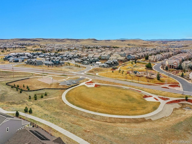 birds eye view of property with a residential view and a mountain view