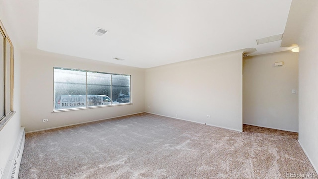 empty room with light carpet and a baseboard radiator