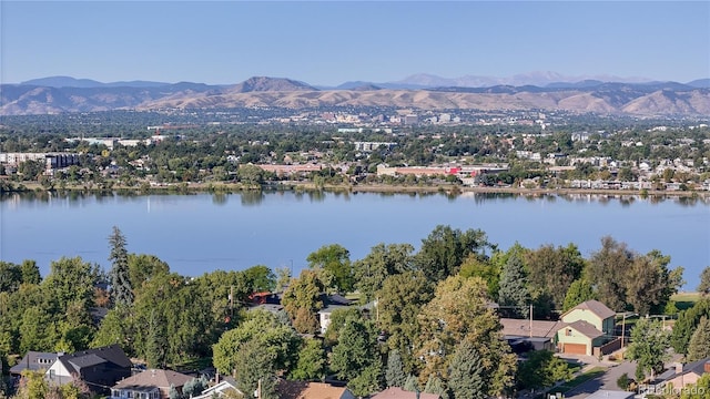 birds eye view of property featuring a water and mountain view