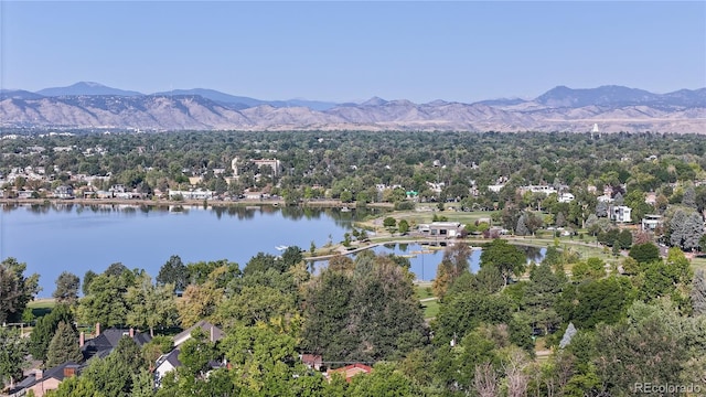 birds eye view of property featuring a water and mountain view