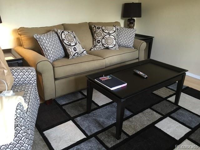 living room with dark wood-type flooring