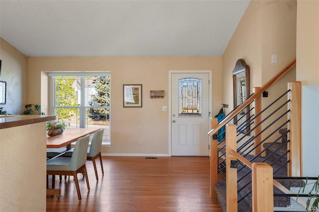11446 W 105th Dr, Broomfield, CO 80021 - entrance foyer with baseboards, wood finished floors, and stairway