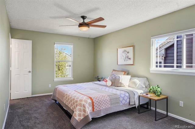 11446 W 105th Dr, Broomfield, CO 80021 - bedroom featuring baseboards, ceiling fan, carpet flooring, and a textured ceiling