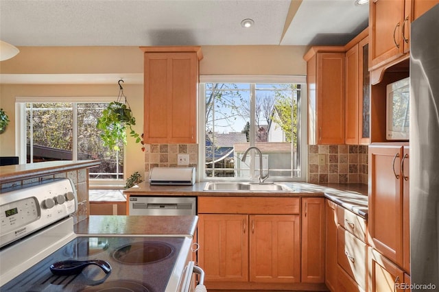 11446 W 105th Dr, Broomfield, CO 80021 - kitchen featuring a sink, dishwasher, recessed lighting, electric stove, and backsplash