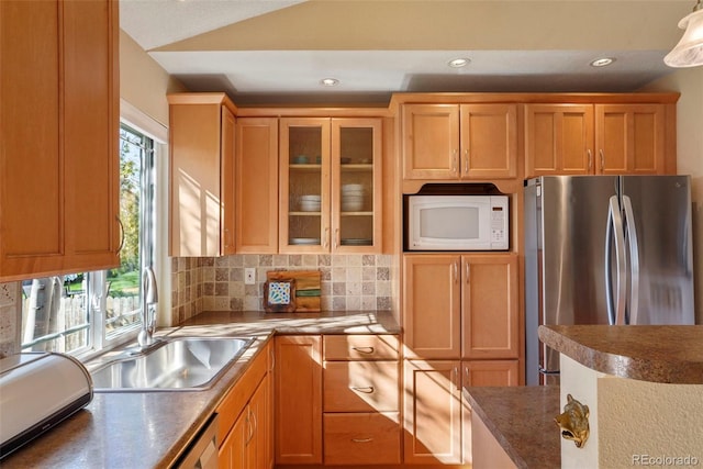11446 W 105th Dr, Broomfield, CO 80021 - kitchen featuring a sink, white microwave, freestanding refrigerator, glass insert cabinets, and recessed lighting