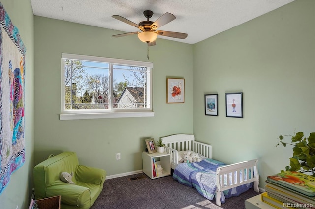 11446 W 105th Dr, Broomfield, CO 80021 - bedroom with baseboards, a ceiling fan, carpet flooring, and a textured ceiling