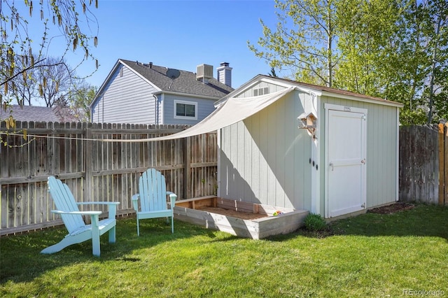11446 W 105th Dr, Broomfield, CO 80021 - back of house featuring a yard, an outbuilding, a storage shed, and a fenced backyard