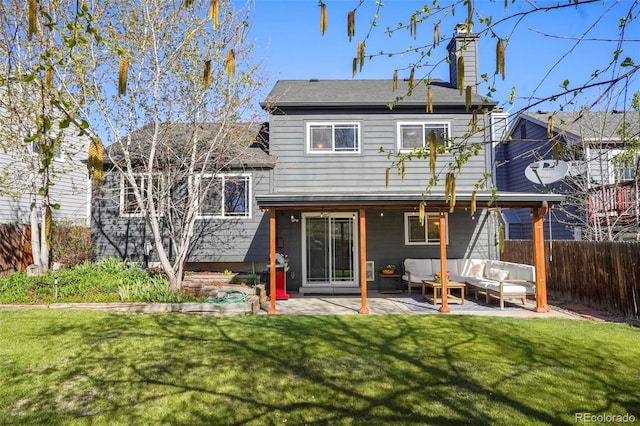 11446 W 105th Dr, Broomfield, CO 80021 - rear view of property with a chimney, an outdoor hangout area, a fenced backyard, a yard, and a patio
