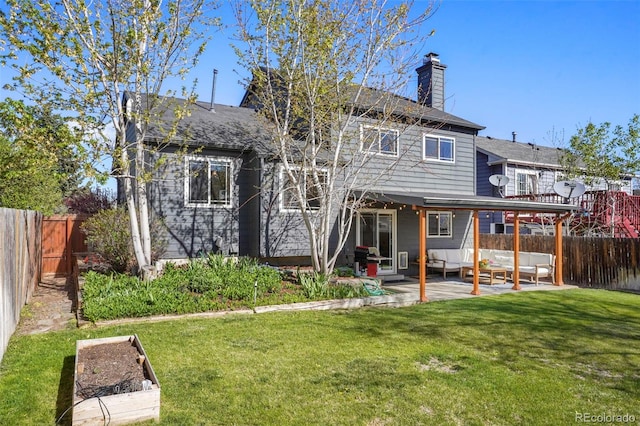 11446 W 105th Dr, Broomfield, CO 80021 - back of property featuring a patio, a fenced backyard, a yard, and a chimney