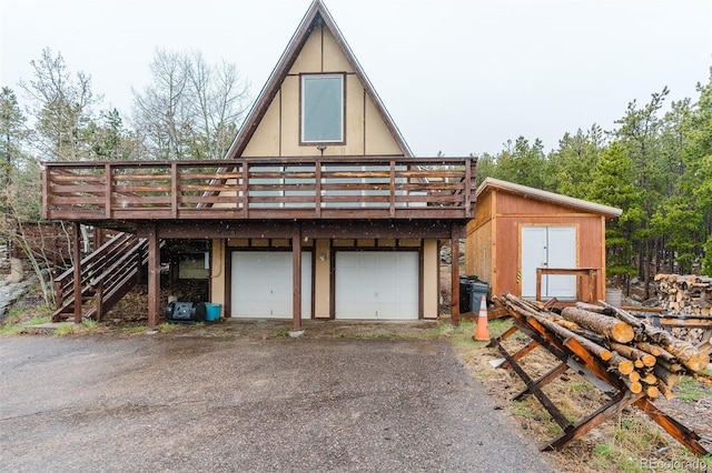 8691 S Warhawk Rd, Conifer, CO 80433 - garage featuring asphalt driveway