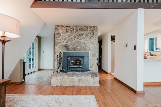8691 S Warhawk Rd, Conifer, CO 80433 - unfurnished living room featuring wood finished floors and baseboards