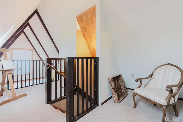 8691 S Warhawk Rd, Conifer, CO 80433 - living area with carpet flooring, an upstairs landing, and baseboards