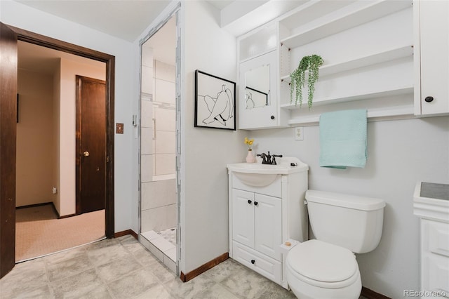 8691 S Warhawk Rd, Conifer, CO 80433 - full bathroom with toilet, baseboards, a stall shower, and vanity